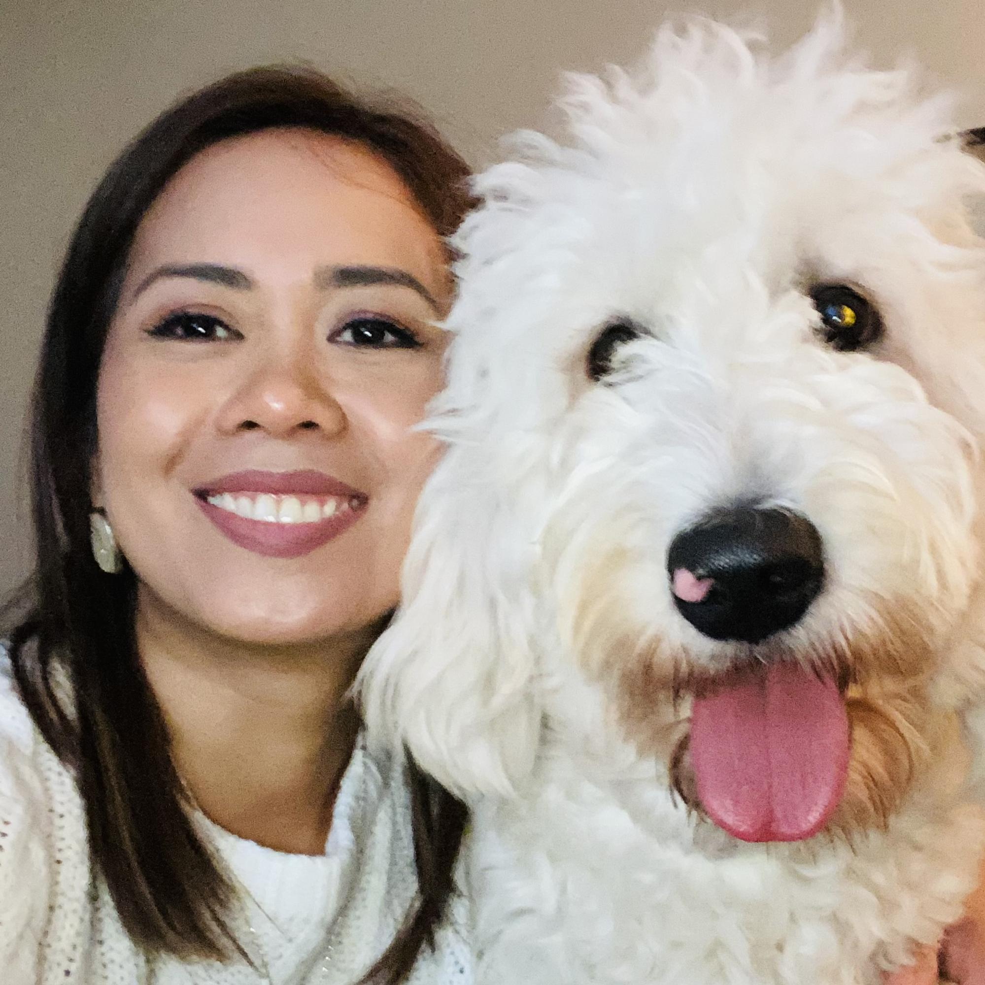 Aiza Haynes of A.N.A. Doodles with her Goldendoodle