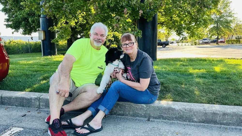 The Carol Gilbert family with Bernedoodle